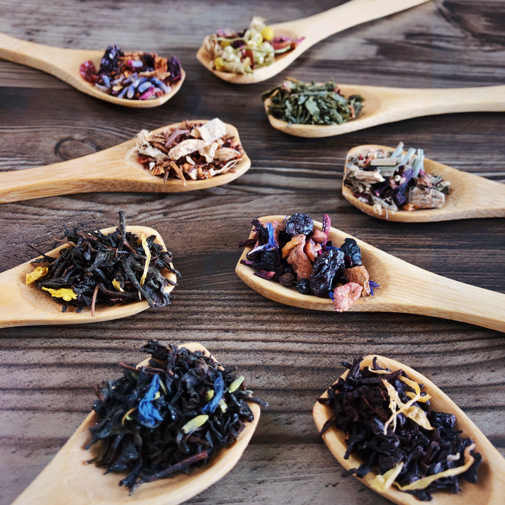 Wooden teaspoons piled with each blend of Bright Witch tea