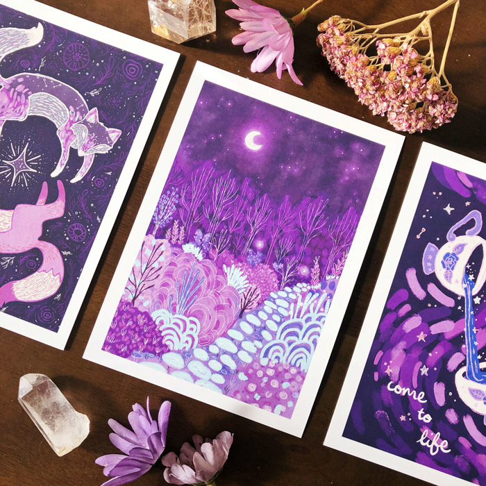 Image shows a selection of A6 art cards featuring ethereal purple artwork