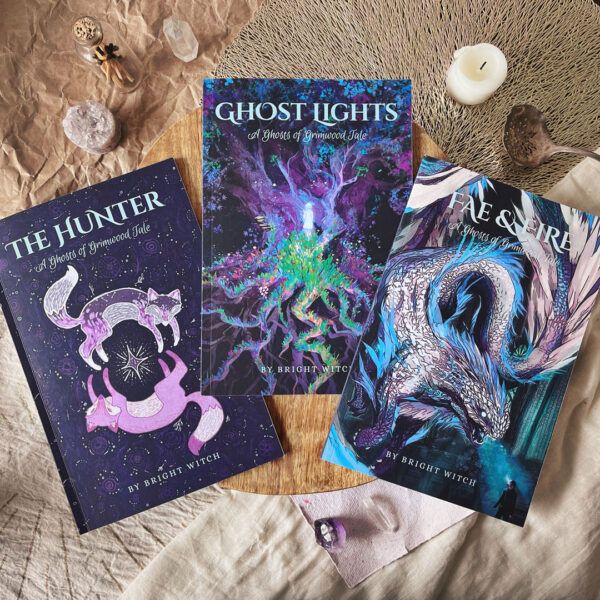 Photograph of three Ghost Lights novelettes: The Hunter, Ghost Lights, and Fae & Fire.
